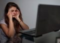 girl having headache due to excessive screen time
