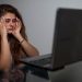 girl having headache due to excessive screen time